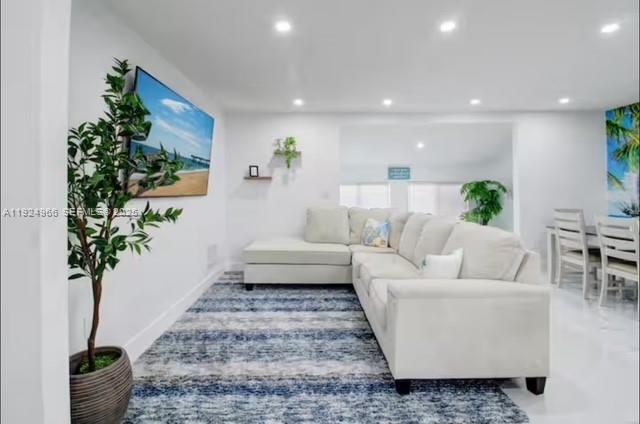 470 Northeast 110th Street Miami, FL 33161 - Photo 5 of 20 a living room with furniture and a potted plant