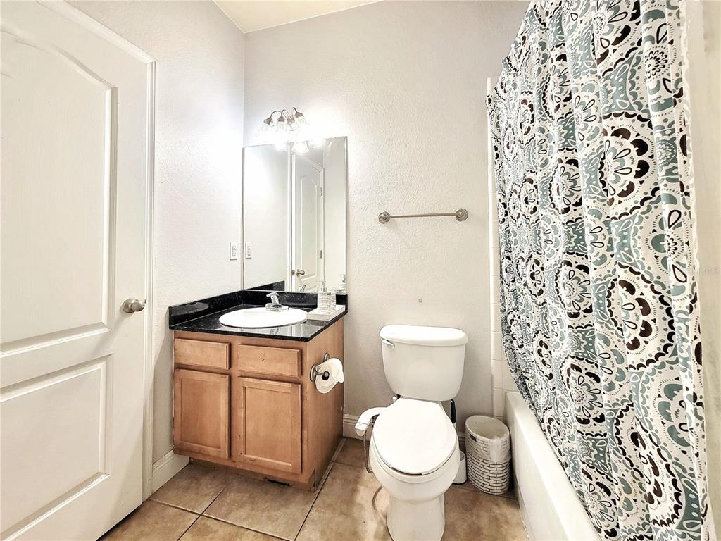 2946 Southwest 35th Place, Unit 44 Gainesville, FL 32608 - Photo 14 of 25 a bathroom with a sink toilet and shower