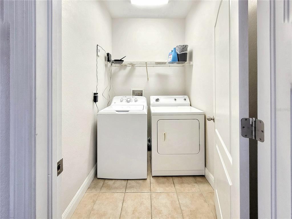 2946 Southwest 35th Place, Unit 44 Gainesville, FL 32608 - Photo 15 of 25 a utility room with dryer and washer