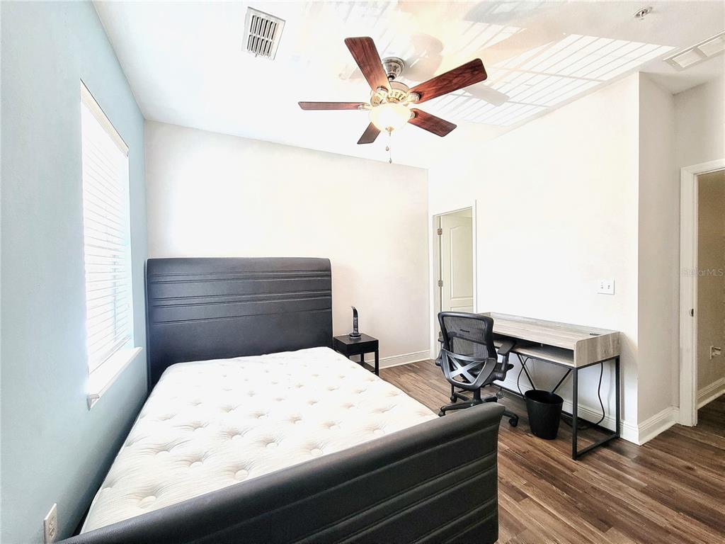 2946 Southwest 35th Place, Unit 44 Gainesville, FL 32608 - Photo 18 of 25 a bed room with a bed