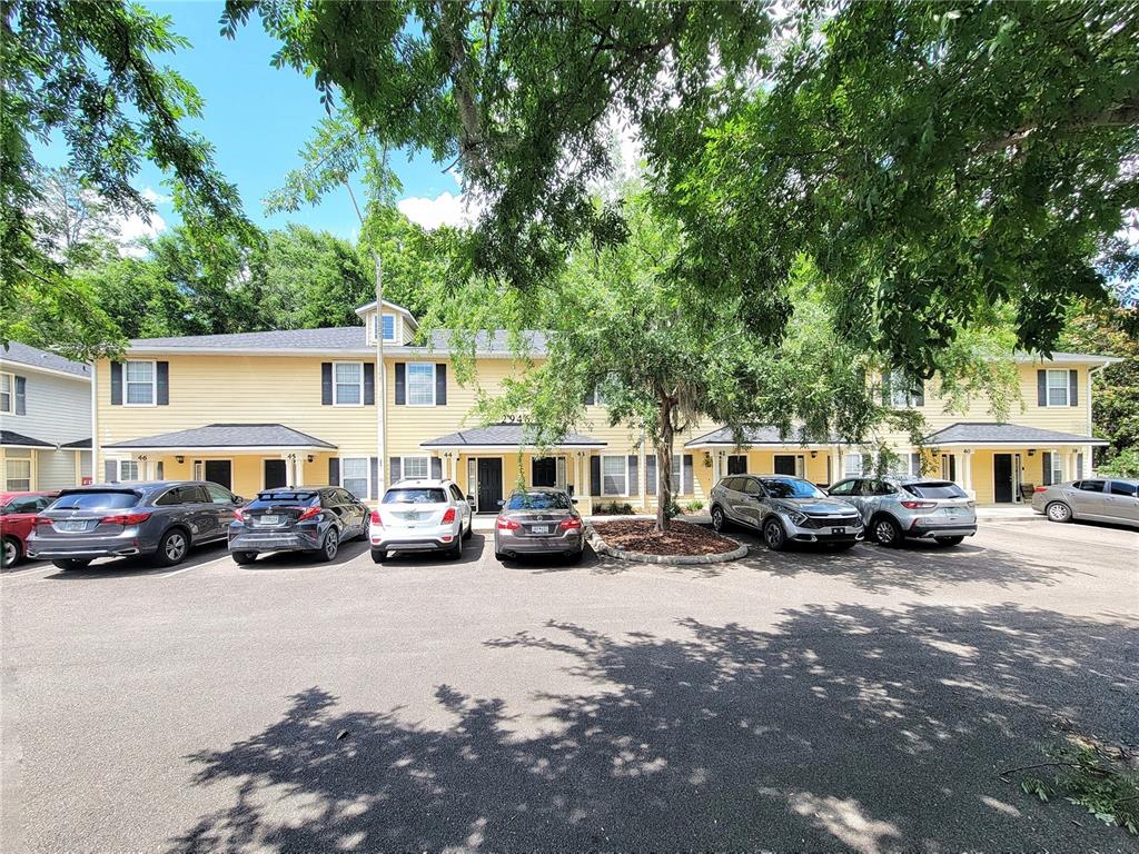 2946 Southwest 35th Place, Unit 44 Gainesville, FL 32608 - Photo 2 of 25 a view of a cars parked in front of a house