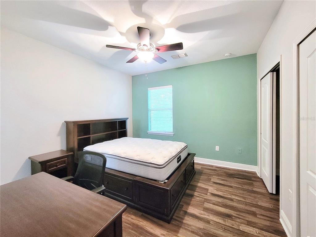 2946 Southwest 35th Place, Unit 44 Gainesville, FL 32608 - Photo 22 of 25 a room with pool table and ceiling fan