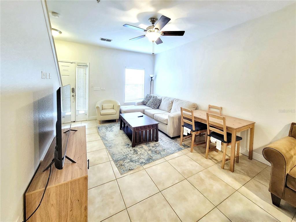 2946 Southwest 35th Place, Unit 44 Gainesville, FL 32608 - Photo 7 of 25 a living room with furniture
