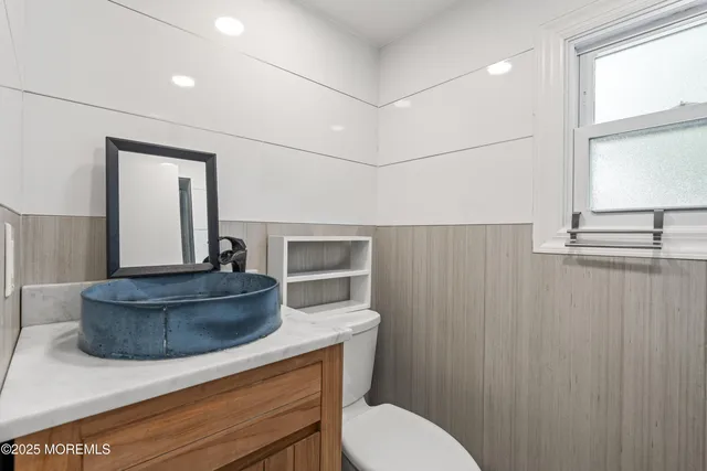 a bathroom with a toilet and a sink