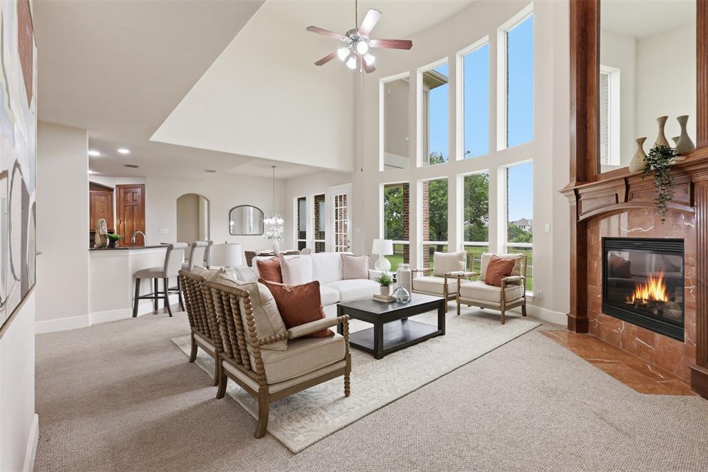 2841 Meadow Ridge Drive Prosper, TX 75078 - Photo 11 of 40 a living room with furniture and a fireplace