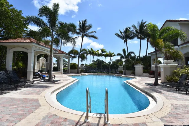 a living room with fireplace furniture and a chandelier