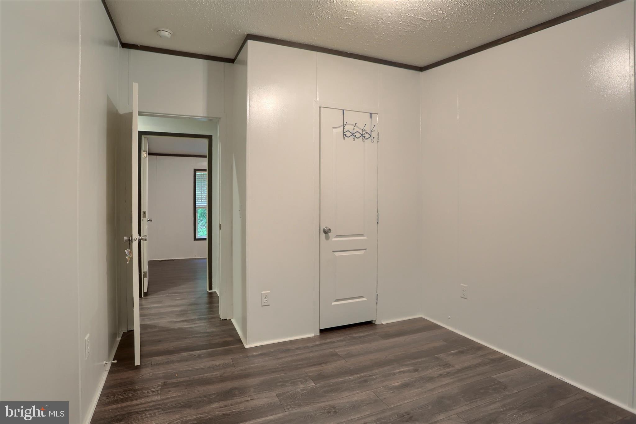 1148 Moulstown Road North Hanover, PA 17331 - Photo 22 of 29 a view of an empty room with wooden floor and a bathroom