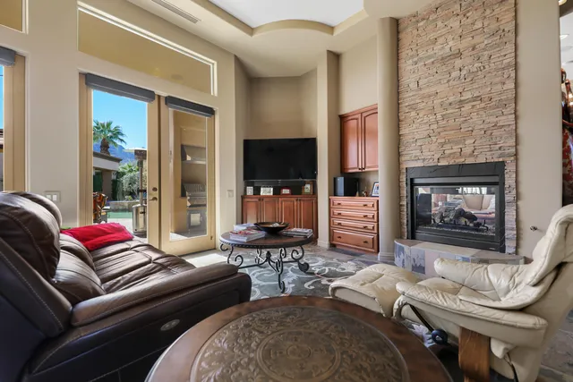 a dining room with furniture and chandelier