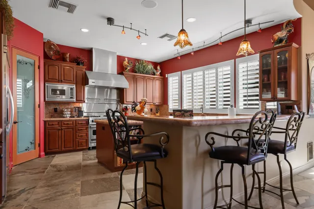 a bed room with a bed and a ceiling fan
