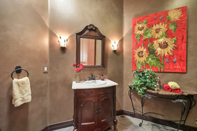 a bathroom with a double vanity sink mirror and shower