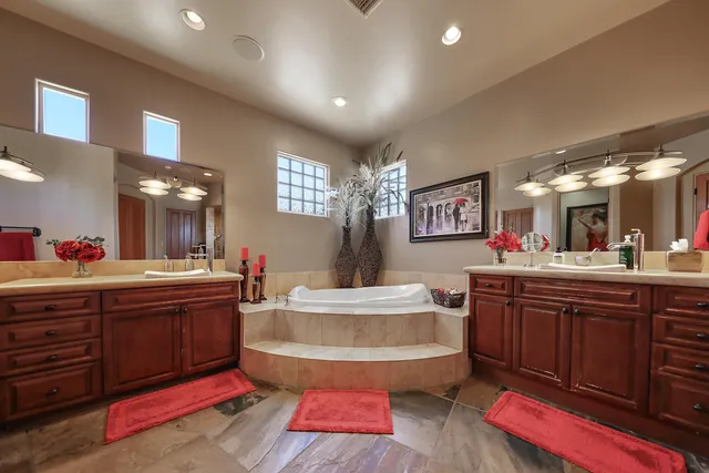 a view of a dining room with furniture and a chandelier