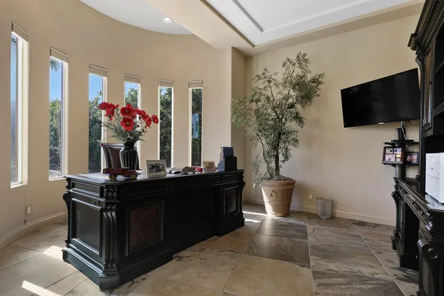 a kitchen with stainless steel appliances granite countertop a refrigerator and wooden cabinets