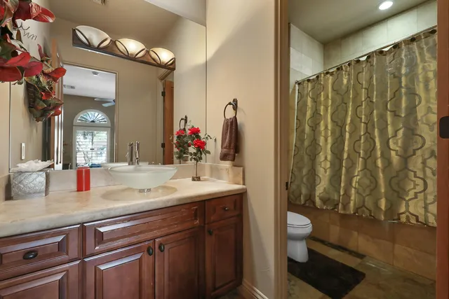 a view of hallway with a window and a kitchen