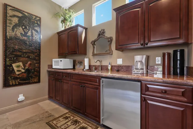 a view of a chairs and table in the patio