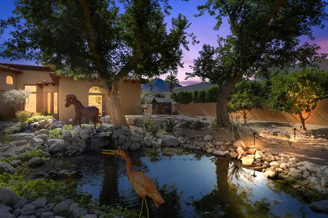 a view of a swimming pool with outdoor seating