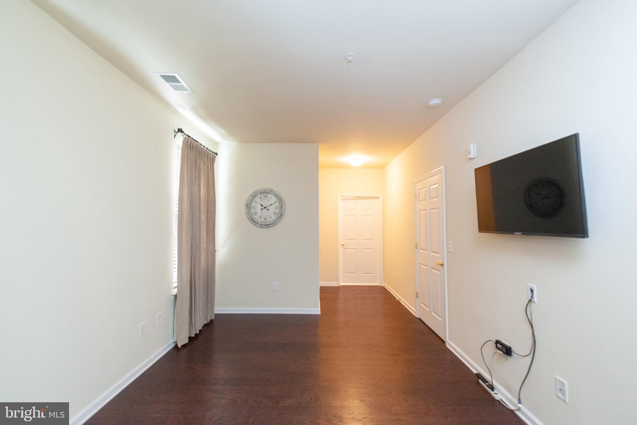 4514 Champions Run, Unit 4514 Cherry Hill, NJ 08002 - Photo 11 of 16 a view of a livingroom with wooden floor