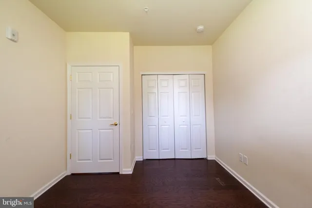 an empty room with wooden floor