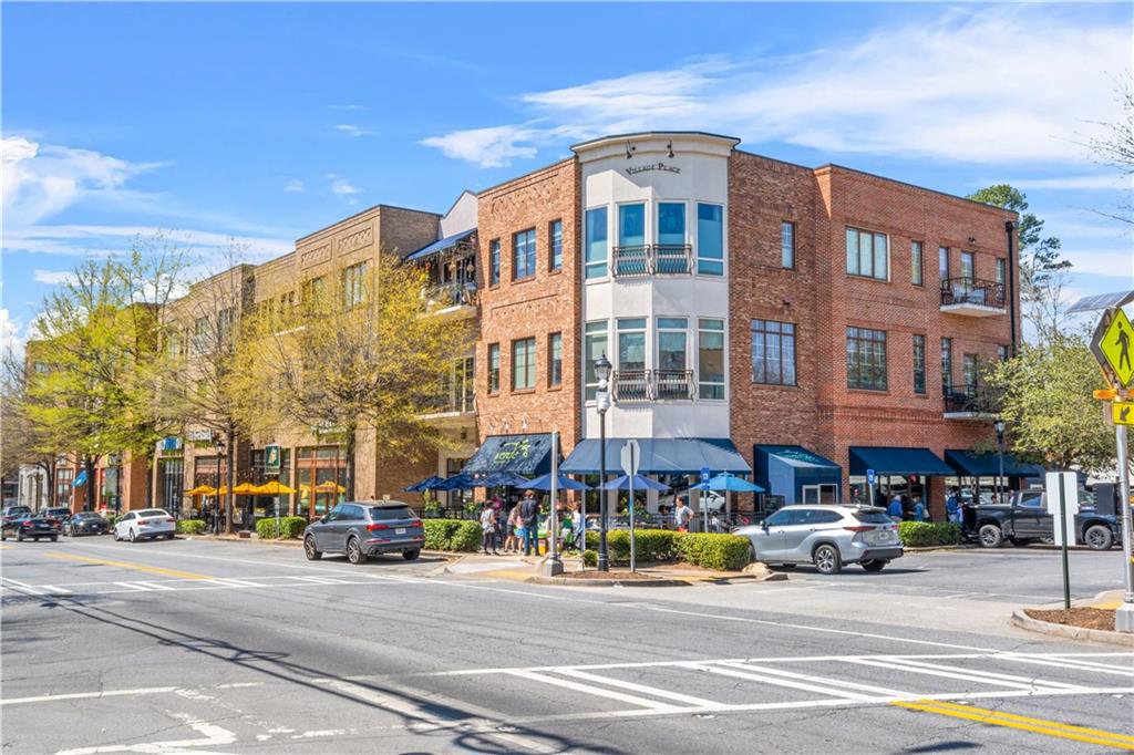 2254 Addington Way, Unit 51 Brookhaven, GA 30319 - Photo 8 of 11 a city street lined with buildings and a street