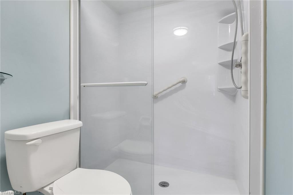 4556 Andover Way, Unit E106 Naples, FL 34112 - Photo 19 of 41 Bathroom with a shower stall