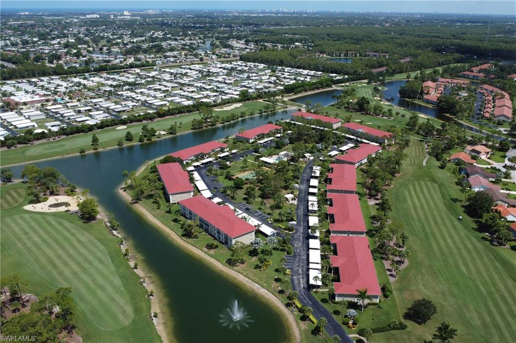 4556 Andover Way, Unit E106 Naples, FL 34112 - Photo 36 of 41 View of property location featuring a large body of water, a local golf course, and nearby suburban area