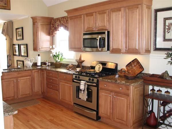 15 A Trail Ridge Way, Unit 49 Harvard, MA 01451 - Photo 5 of 30 a kitchen with stainless steel appliances granite countertop a stove top oven a sink dishwasher and cabinets with wooden floor