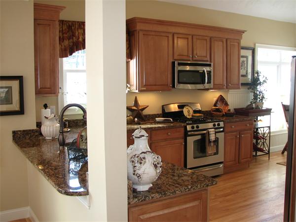 15 A Trail Ridge Way, Unit 49 Harvard, MA 01451 - Photo 6 of 30 a kitchen with stainless steel appliances granite countertop a stove and a microwave