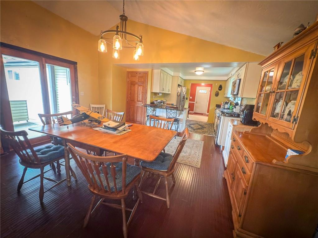 829 Saxonburg Road Butler, PA 16002 - Photo 12 of 49 a dining room with furniture a chandelier and wooden floor