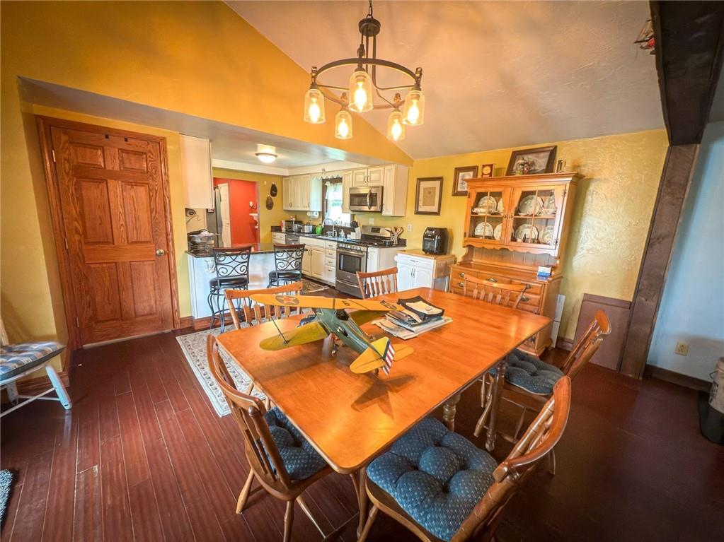 829 Saxonburg Road Butler, PA 16002 - Photo 13 of 49 a view of a dining room with furniture wooden floor and a chandelier