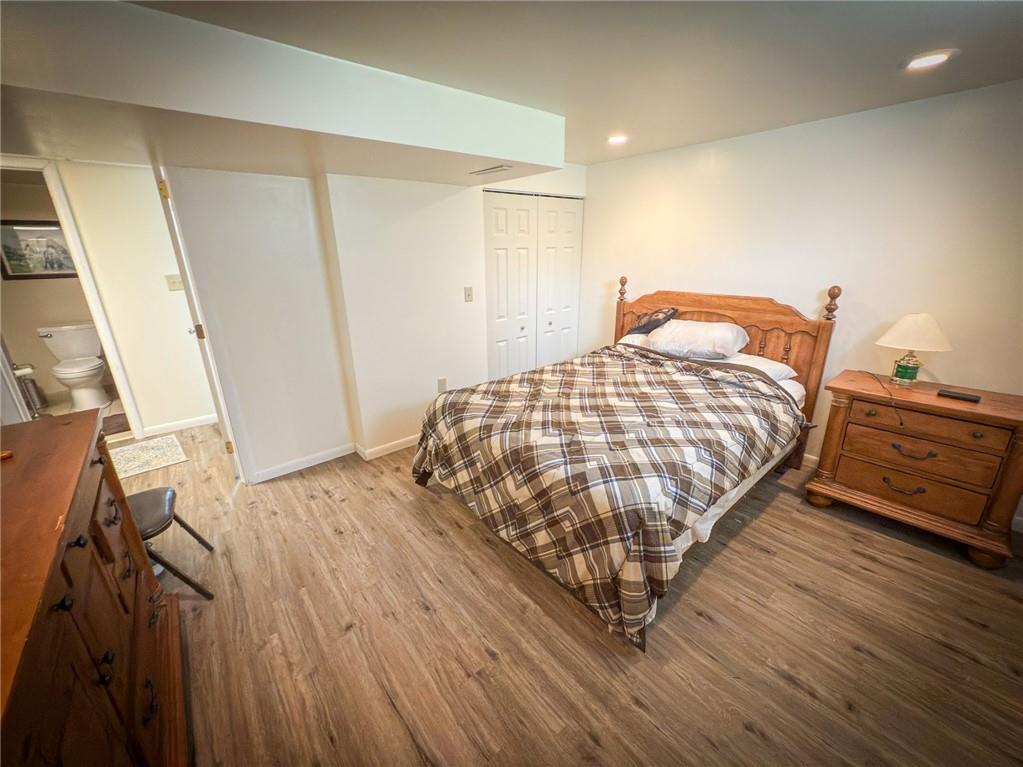 829 Saxonburg Road Butler, PA 16002 - Photo 34 of 49 a bedroom with a bed and wooden floor