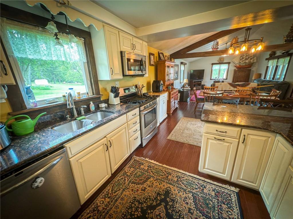829 Saxonburg Road Butler, PA 16002 - Photo 7 of 49 a kitchen with stainless steel appliances granite countertop sink stove top oven and cabinets