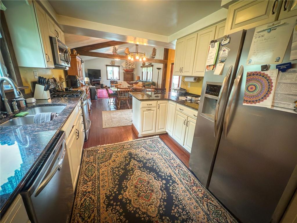 829 Saxonburg Road Butler, PA 16002 - Photo 8 of 49 a kitchen with stainless steel appliances granite countertop a refrigerator and a stove