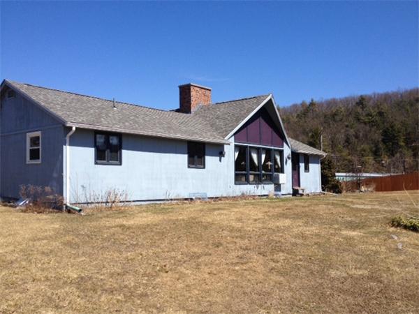 43 1/2 Bethany Road Monson, MA 01057 - Photo 3 of 13 a front view of a house with a yard