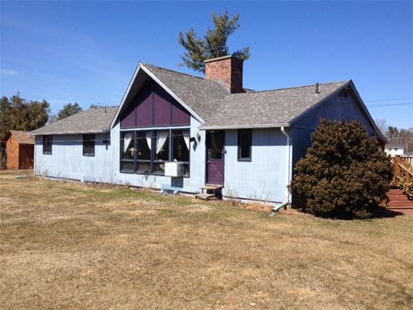 43 1/2 Bethany Road Monson, MA 01057 - Photo 4 of 13 a front view of a house with a garden and yard