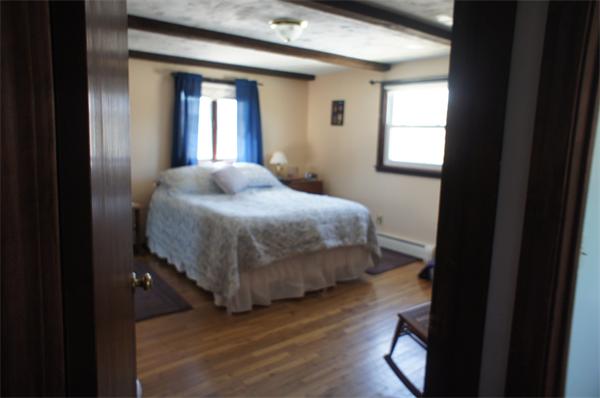 43 1/2 Bethany Road Monson, MA 01057 - Photo 8 of 13 a bedroom with a bed and window