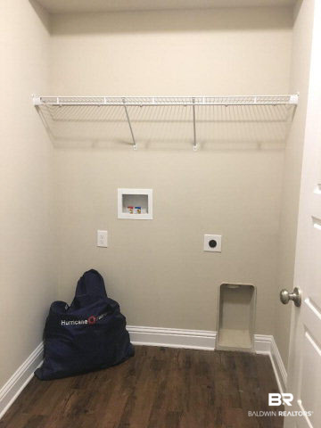 6618 Spaniel Drive, Unit 50B Spanish Fort, AL 36527 - Photo 7 of 16 Each townhome comes with hurricane fabric for buyers' doors and windows.