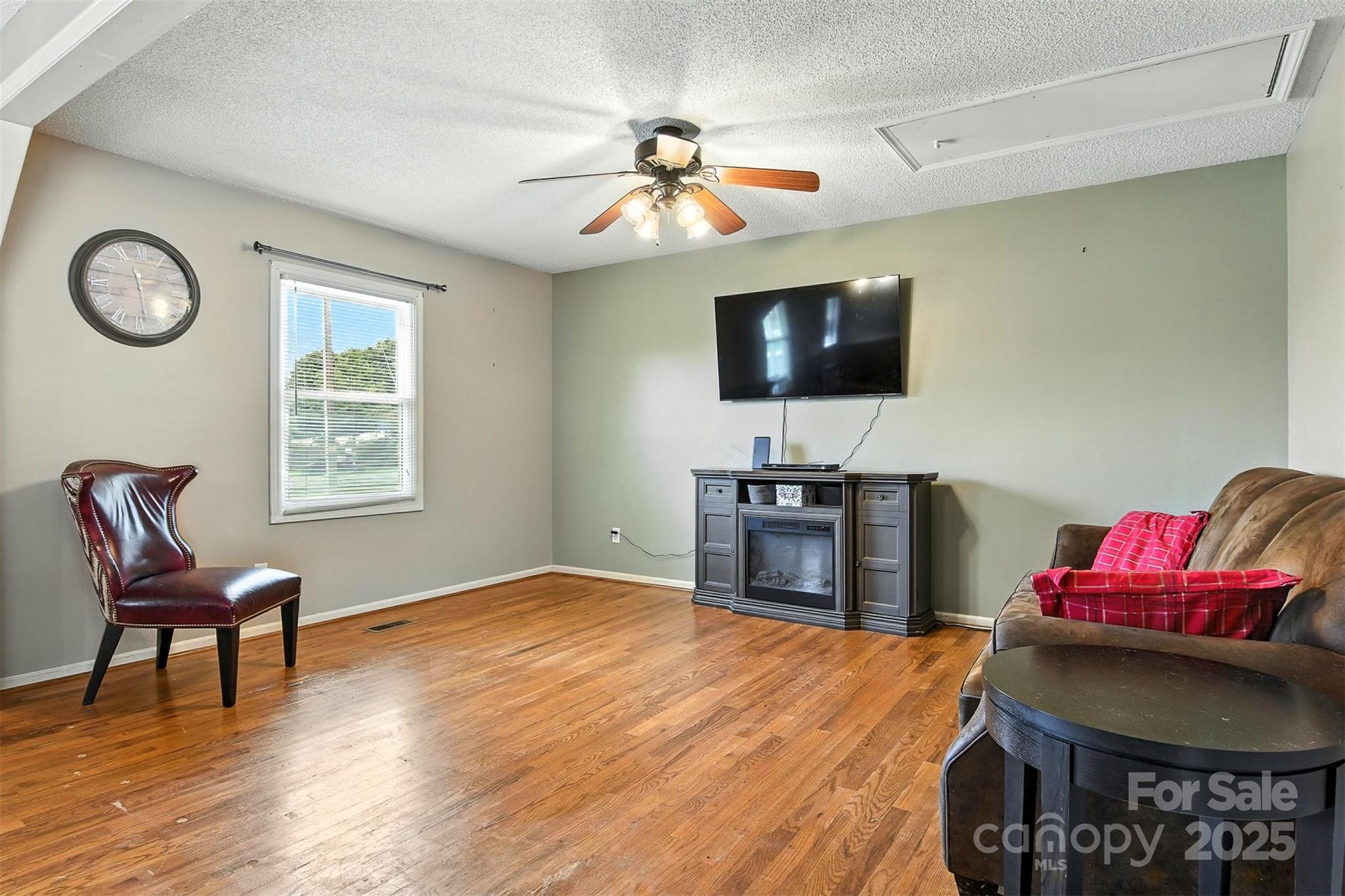 952 30th Street Northeast Conover, NC 28613 - Photo 12 of 36 a living room with furniture and a flat screen tv