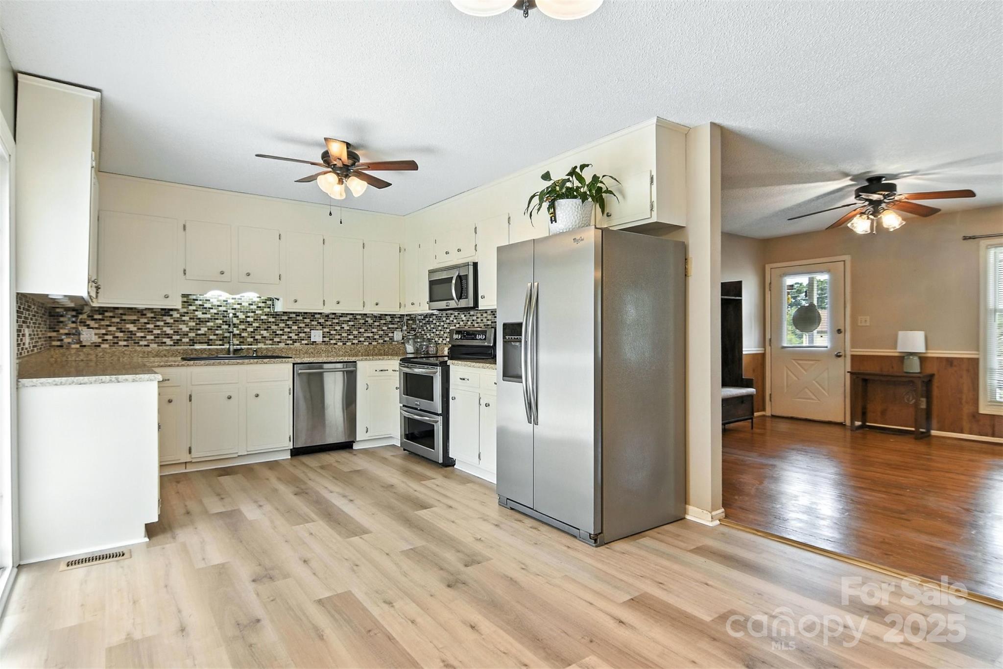 952 30th Street Northeast Conover, NC 28613 - Photo 15 of 36 a kitchen with stainless steel appliances granite countertop a refrigerator and a stove