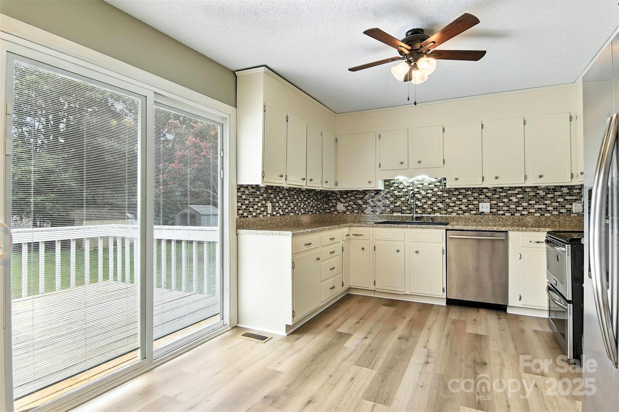 952 30th Street Northeast Conover, NC 28613 - Photo 17 of 36 a kitchen with a white cabinets and window