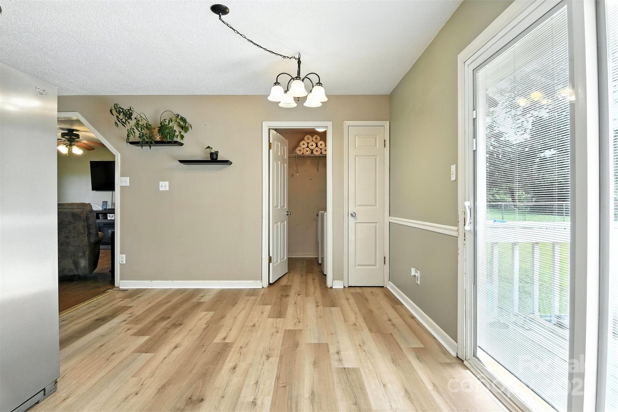 952 30th Street Northeast Conover, NC 28613 - Photo 18 of 36 a view of a hallway with wooden floor and staircase