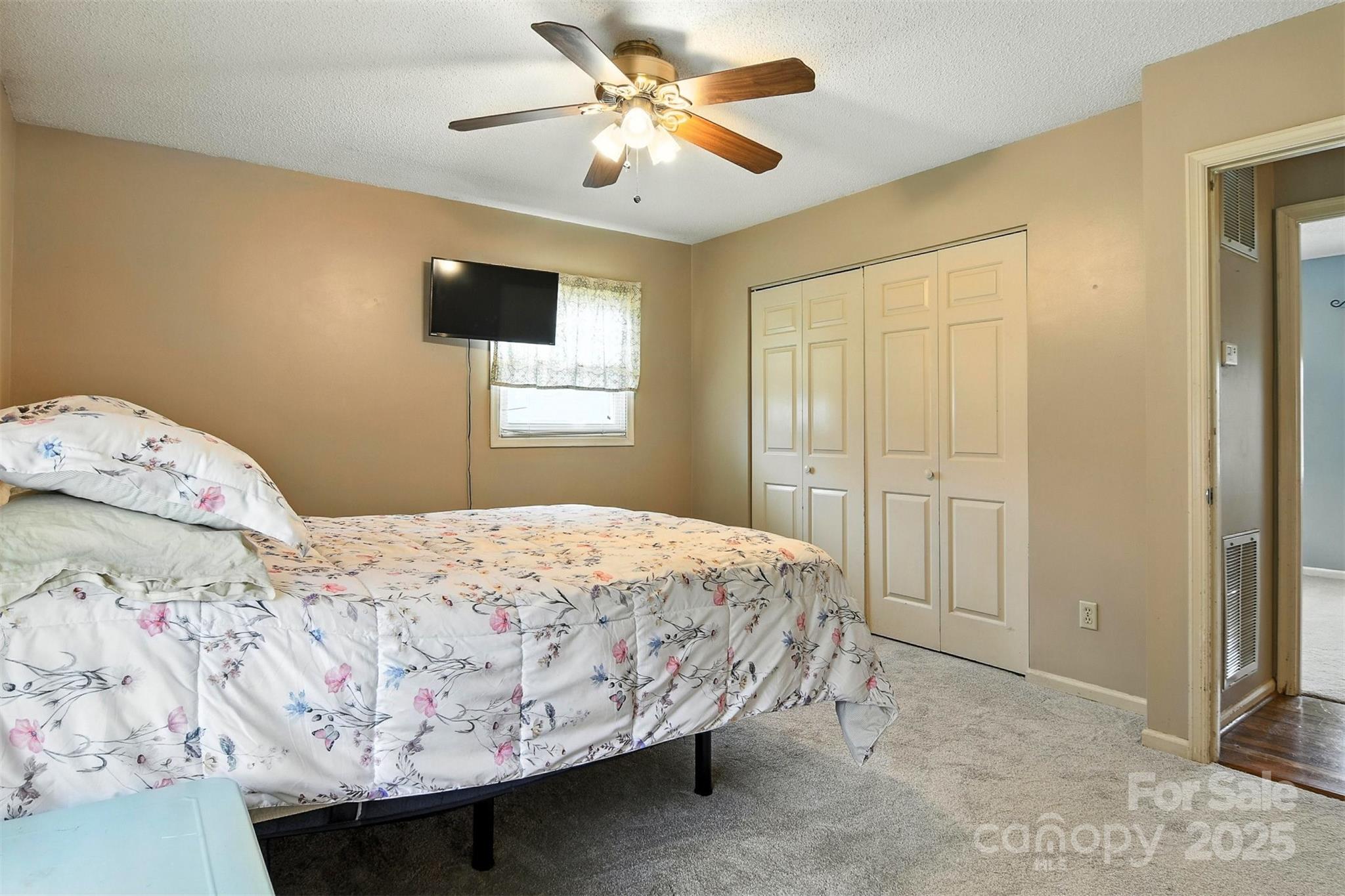 952 30th Street Northeast Conover, NC 28613 - Photo 20 of 36 a bedroom with a bed and a chandelier