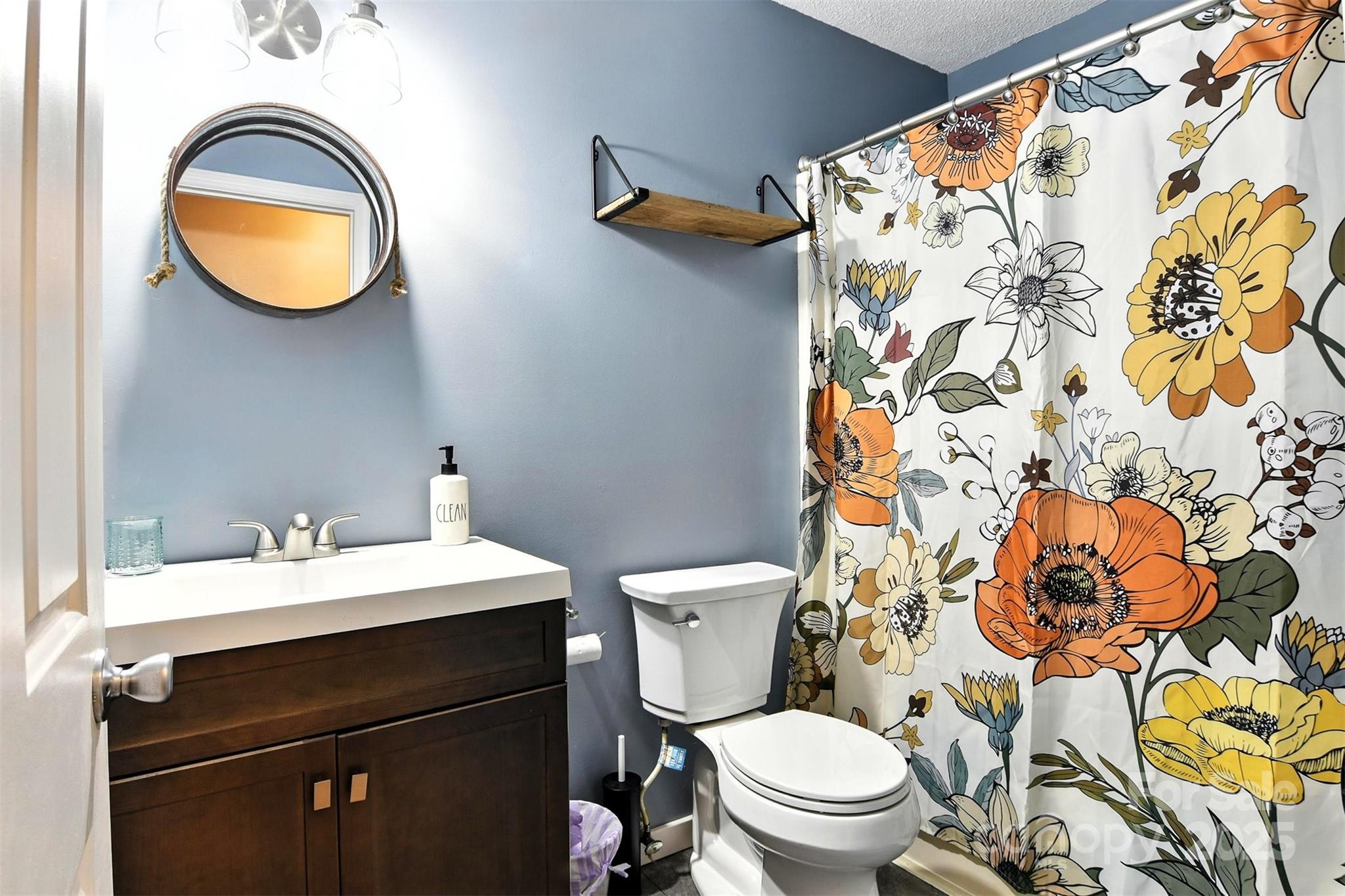 952 30th Street Northeast Conover, NC 28613 - Photo 25 of 36 a bathroom with a sink and a mirror