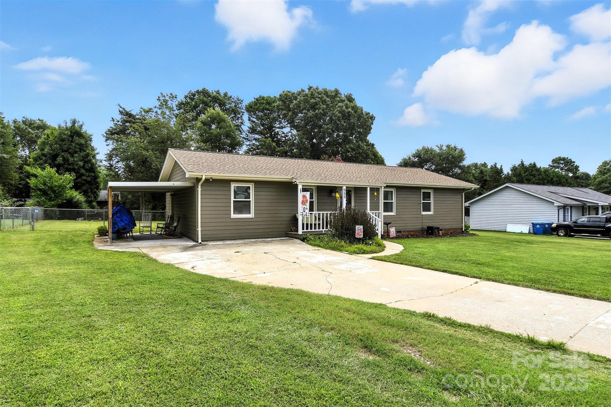 952 30th Street Northeast Conover, NC 28613 - Photo 4 of 36 a front view of a house with a garden and trees
