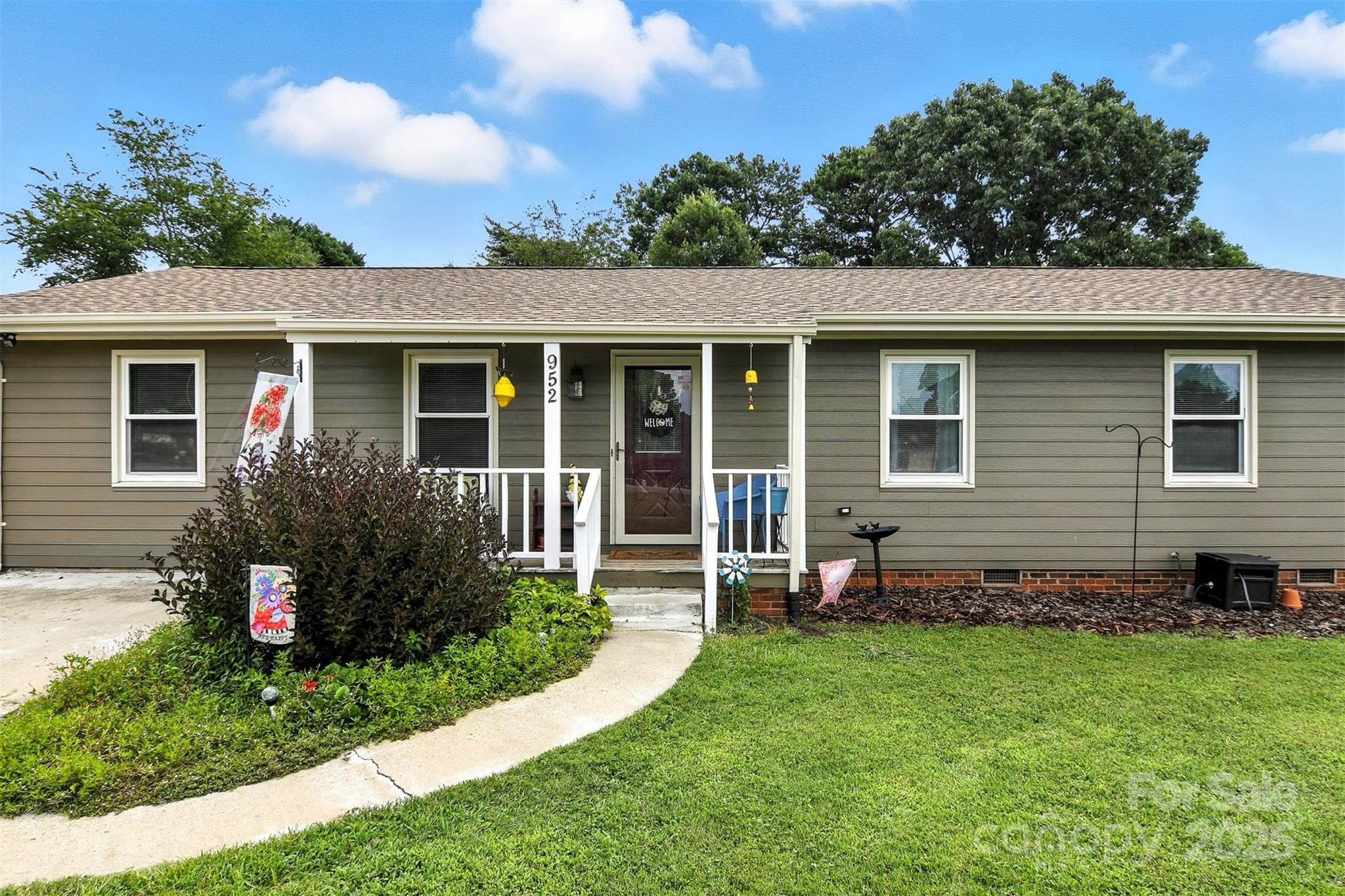 952 30th Street Northeast Conover, NC 28613 - Photo 5 of 36 a view of a house with a yard and plants