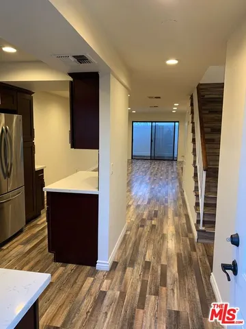 a view of kitchen and wooden floor