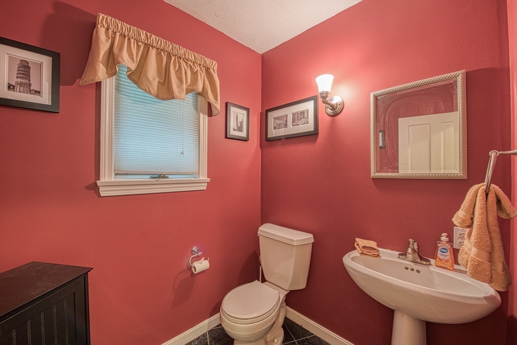 7 Tisdale Road Sharon, MA 02067 - Photo 10 of 37 a bathroom with a toilet sink and mirror