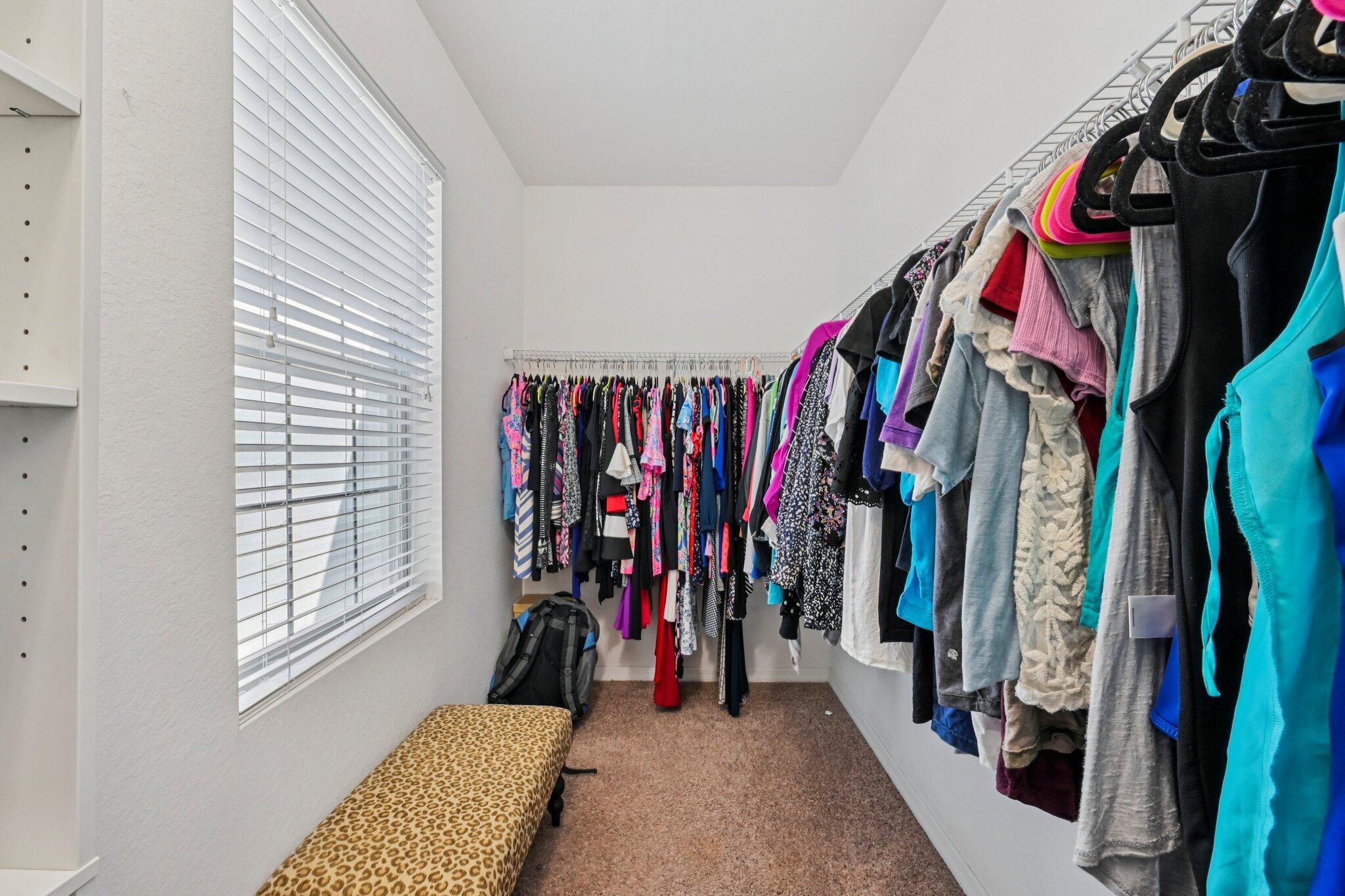 482 Graham Place Boynton Beach, FL 33435 - Photo 18 of 39 a view of walk in closet with clothes