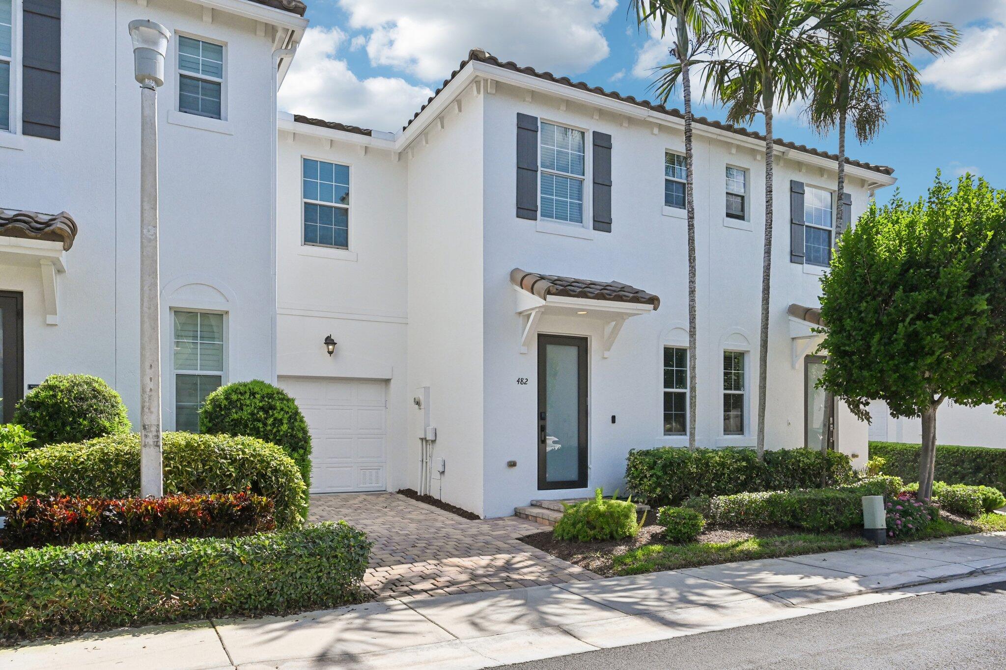 482 Graham Place Boynton Beach, FL 33435 - Photo 2 of 39 a front view of a house with a yard