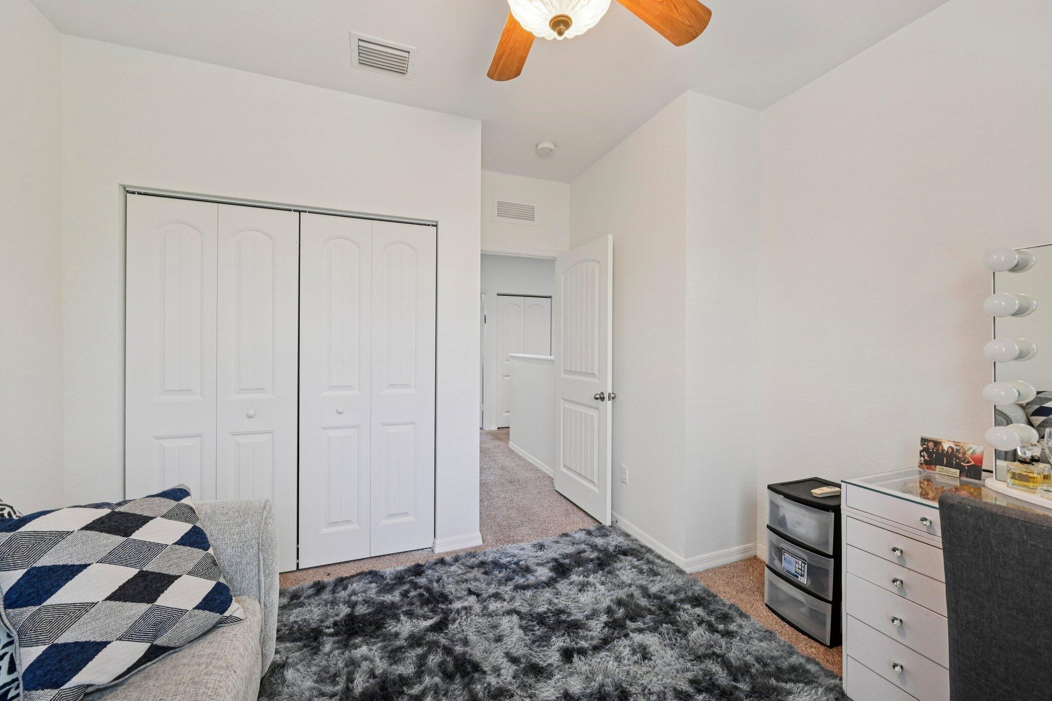 482 Graham Place Boynton Beach, FL 33435 - Photo 21 of 39 a bedroom with a bed and a dresser