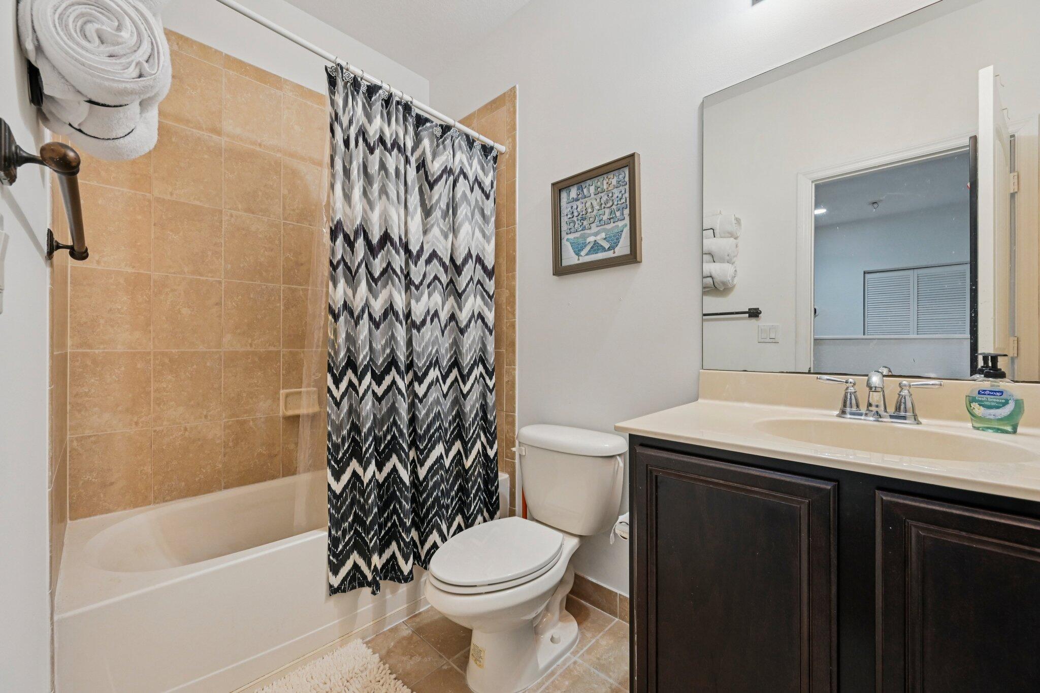 482 Graham Place Boynton Beach, FL 33435 - Photo 22 of 39 a bathroom with a sink toilet and shower