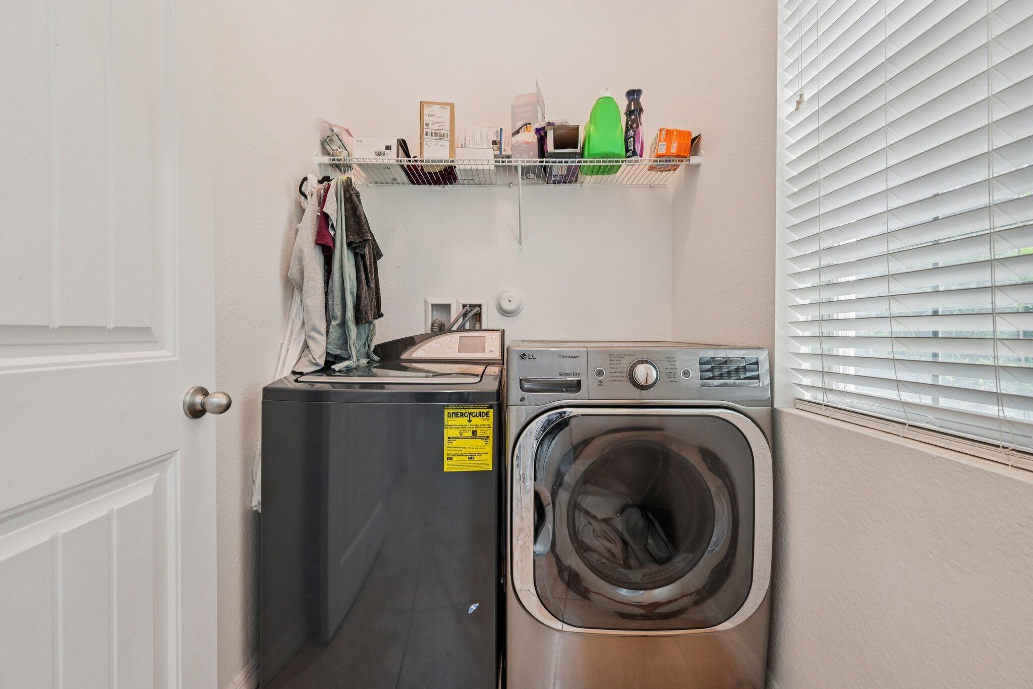 482 Graham Place Boynton Beach, FL 33435 - Photo 26 of 39 a utility room with dryer and washer